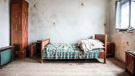 Bedroom in a state of disrepair